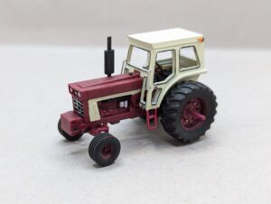 PXL_20260303_040405636 HO Scale Red 66 Tractor With Cab Wide Front